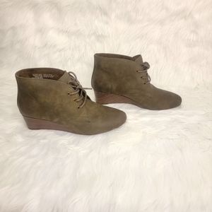 Olive ankle boots with laces.